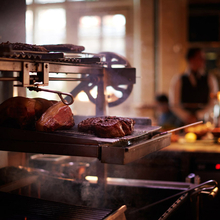 JOS-034-Steaks cooking on the grill in the chiltern firehouse.jpg